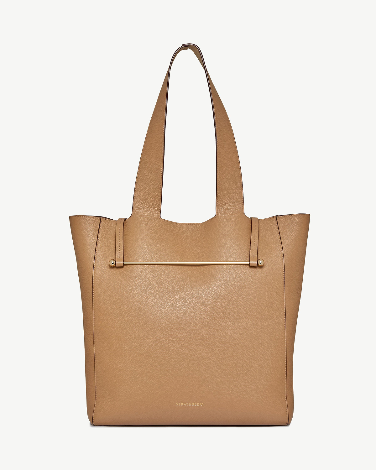 Strathberry Melody tote in caramel pebbled leather with external gold bar detail.