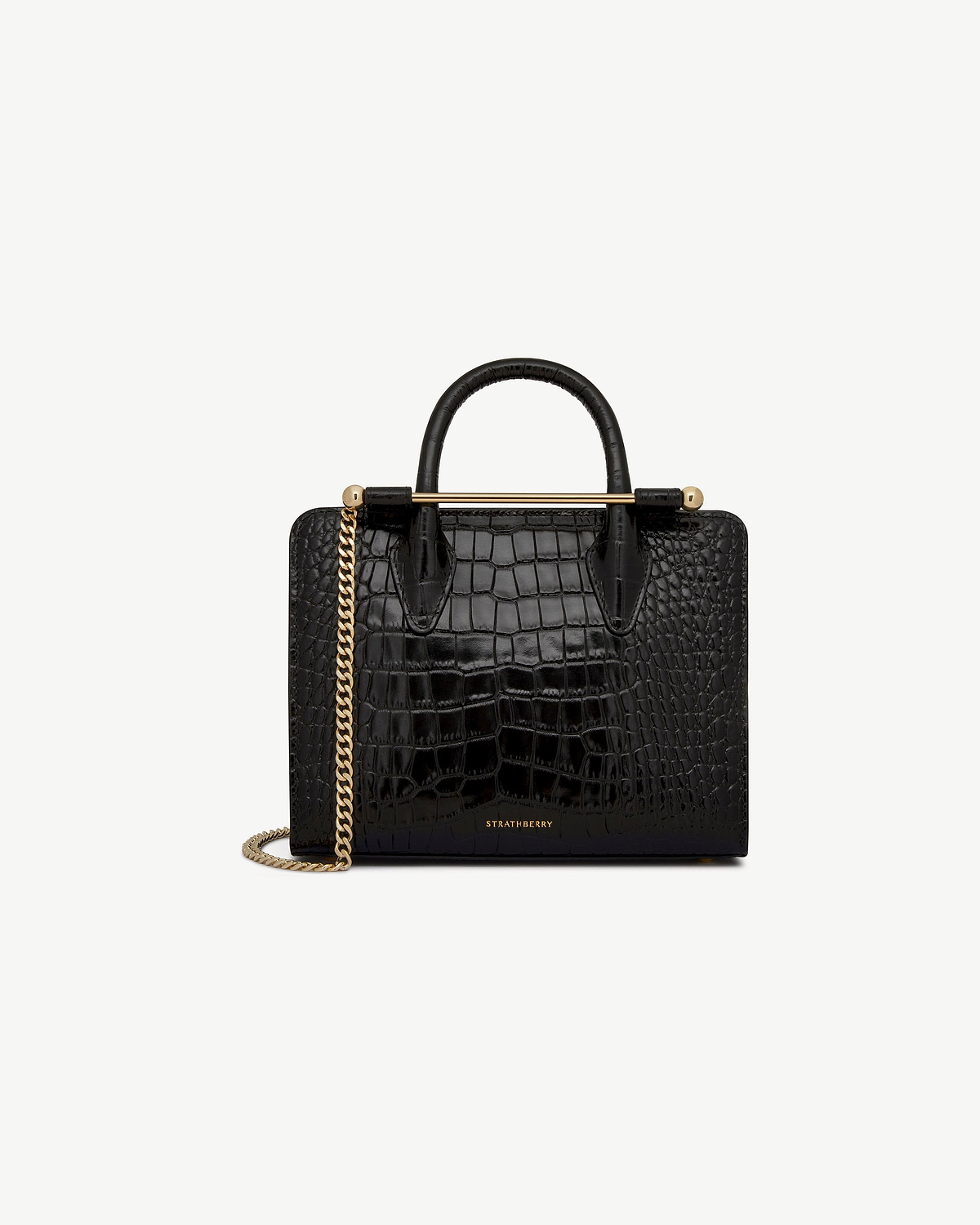Strathberry black croc mini tote with top handles, gold bar and chain strap.