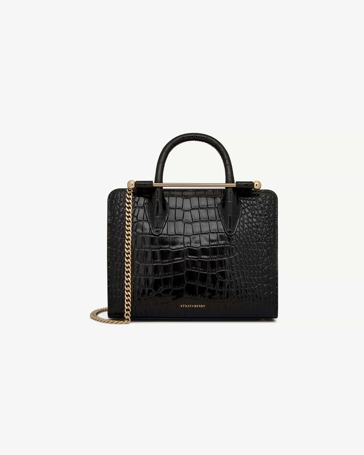 Strathberry black croc mini tote with top handles, gold bar and chain strap.