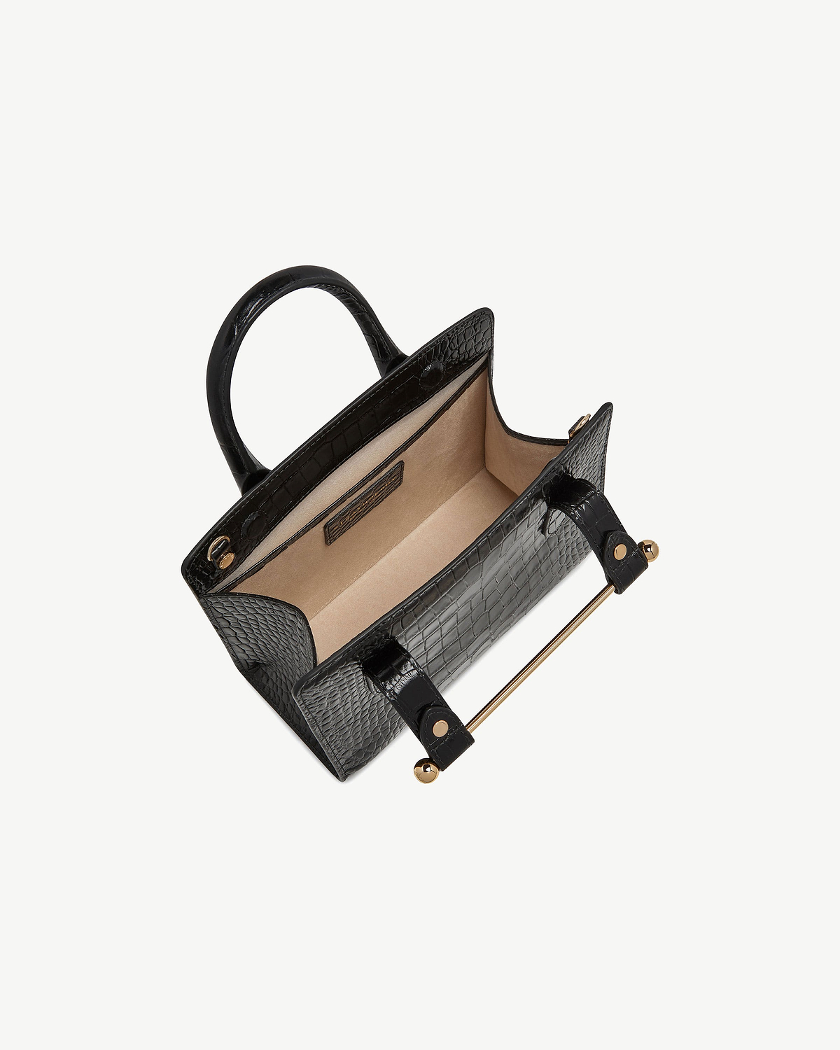 Black croc-embossed mini tote with open beige interior and gold bar handle