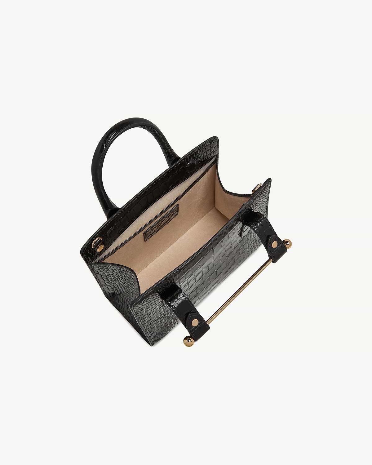 Black croc-embossed mini tote with open beige interior and gold bar handle
