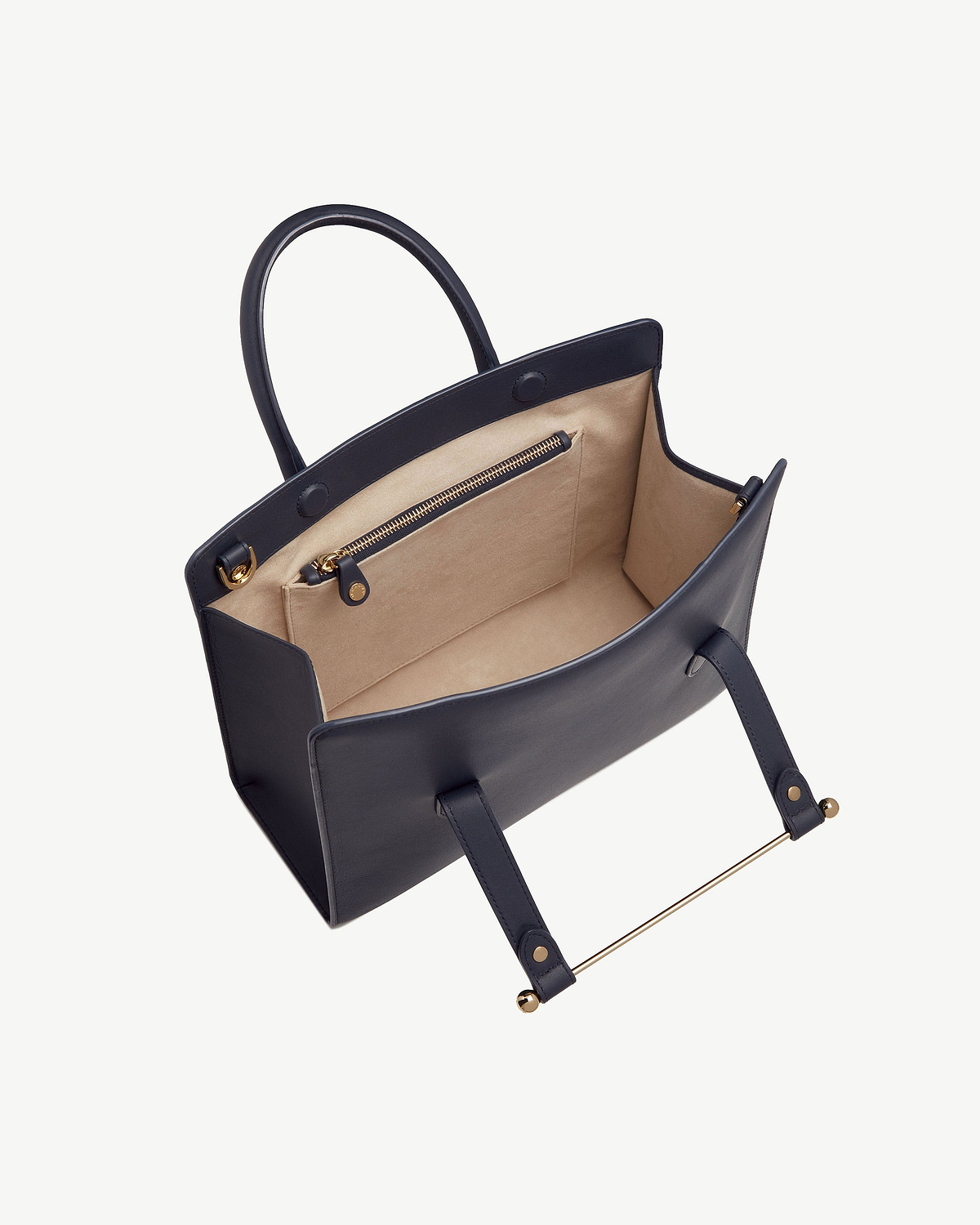 Marine blue midi tote with beige lining, interior zip pocket and gold hardware.