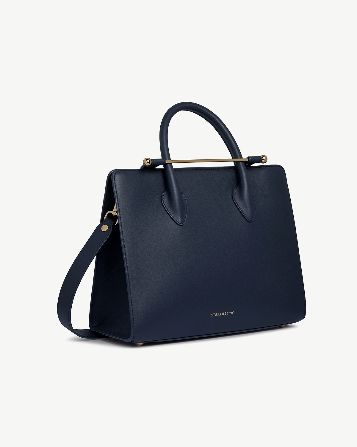 Marine blue Strathberry midi tote with top handles, detachable shoulder strap, gold hardware.