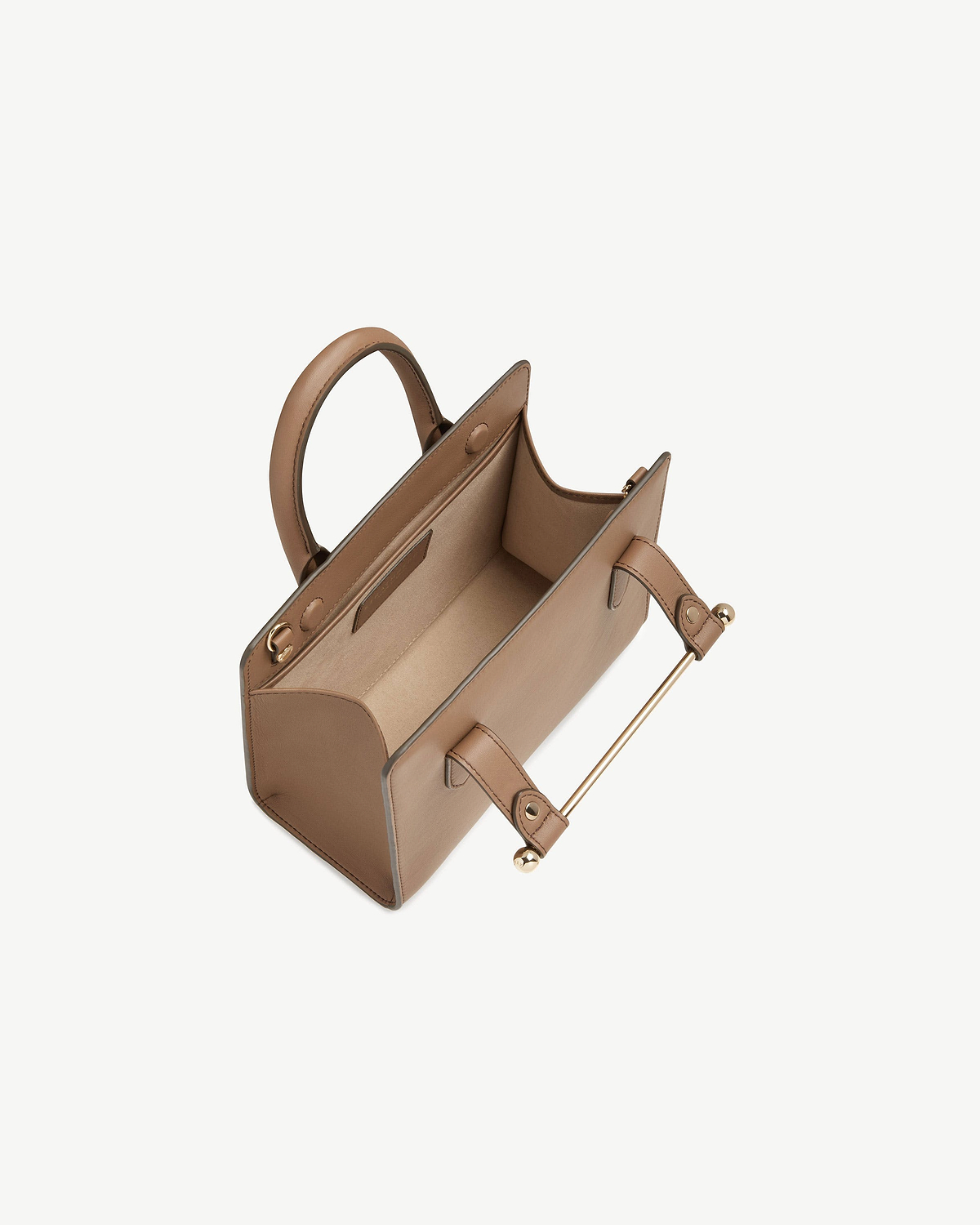 Top view of clay mini tote showing interior, handles and gold metal bar.
