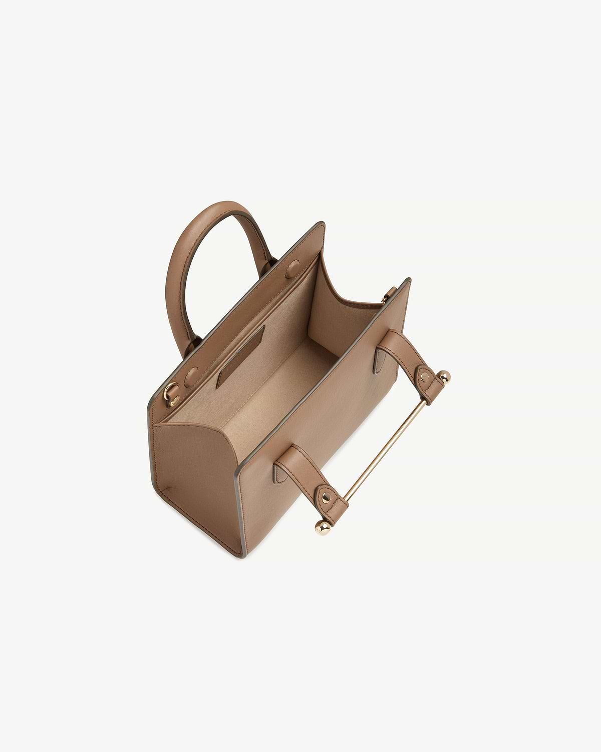 Top view of clay mini tote showing interior, handles and gold metal bar.
