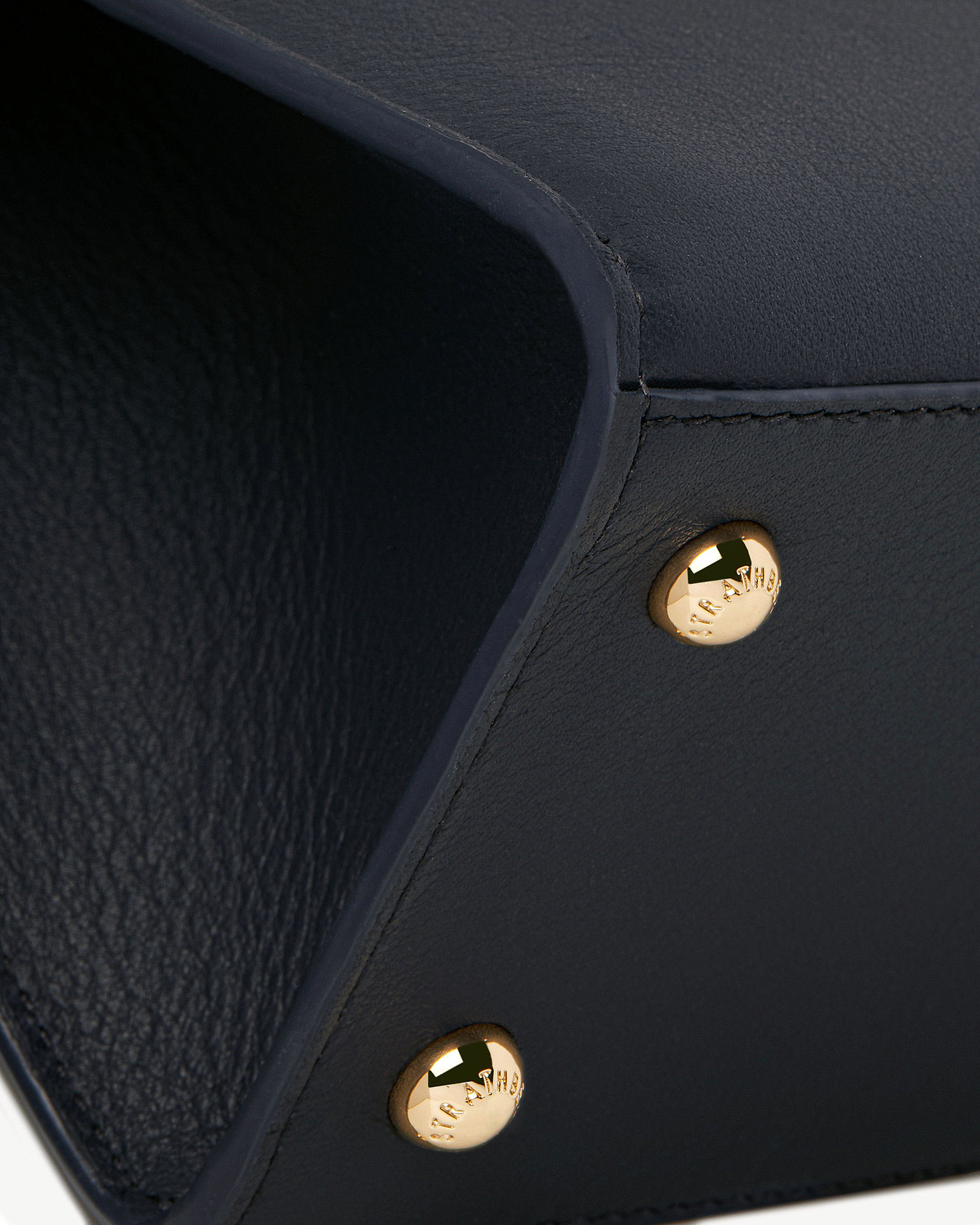 Marine blue mini tote interior edge with gold Strathberry rivet