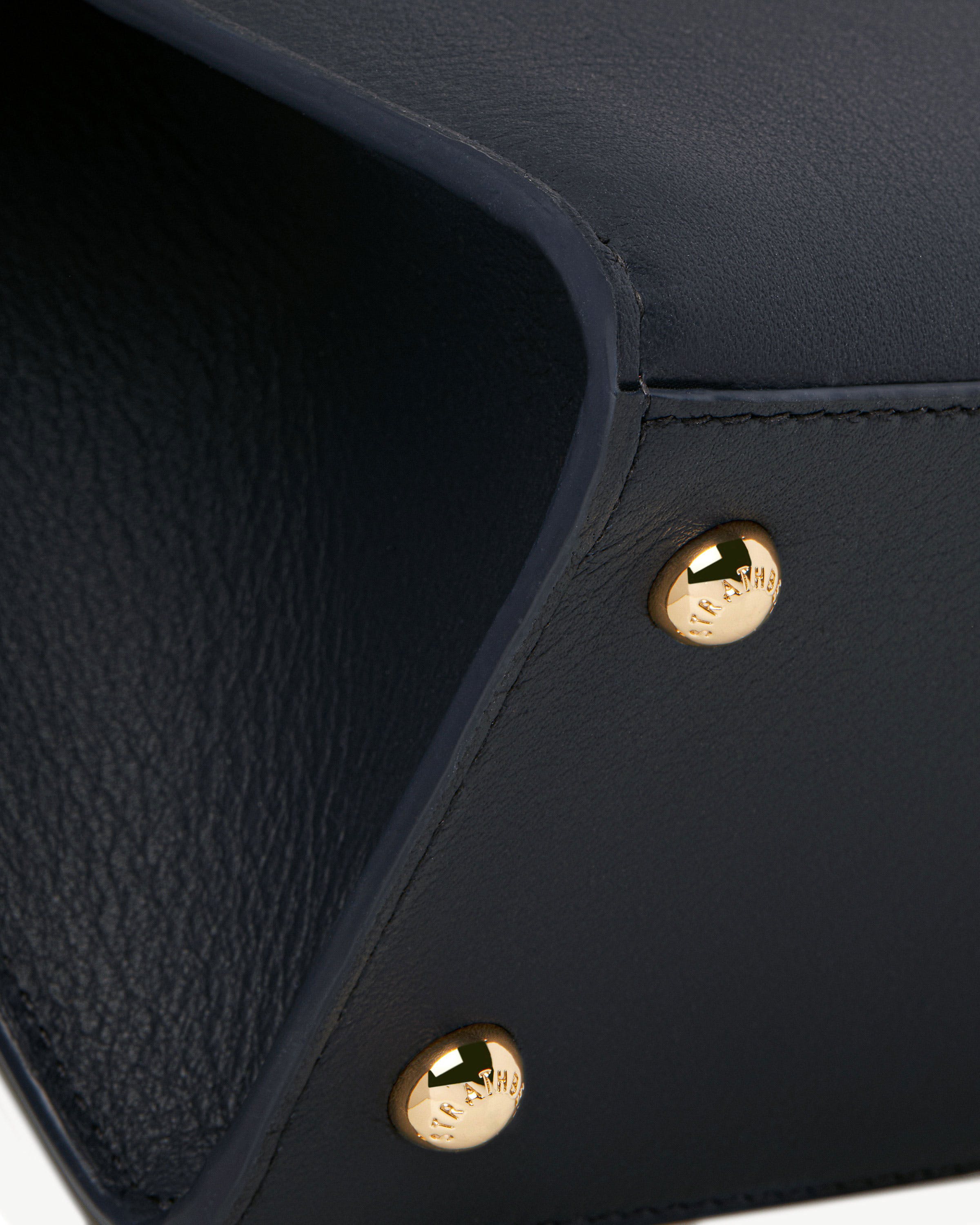 Marine blue mini tote interior edge with gold Strathberry rivet