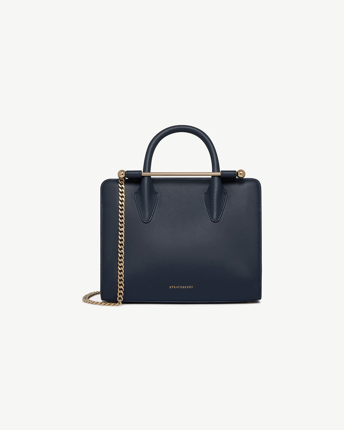 Strathberry marine blue mini tote with top handle and gold chain strap