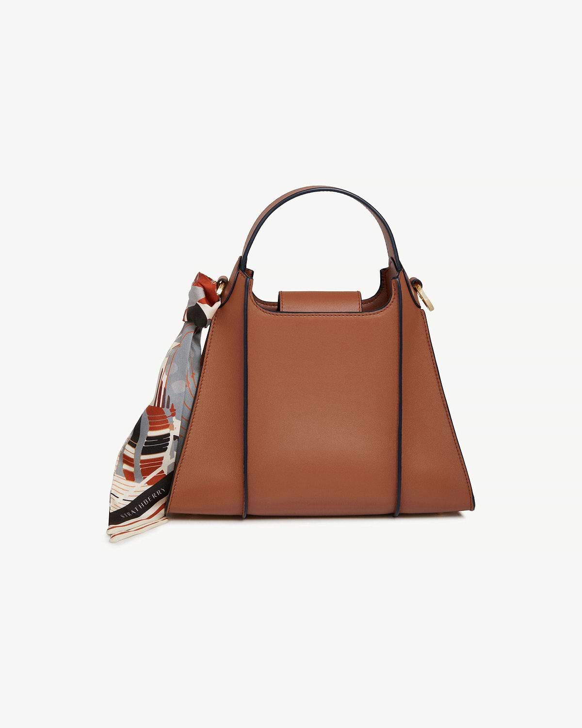 Tan Arkshell top-handle handbag with patterned silk scarf tied to side