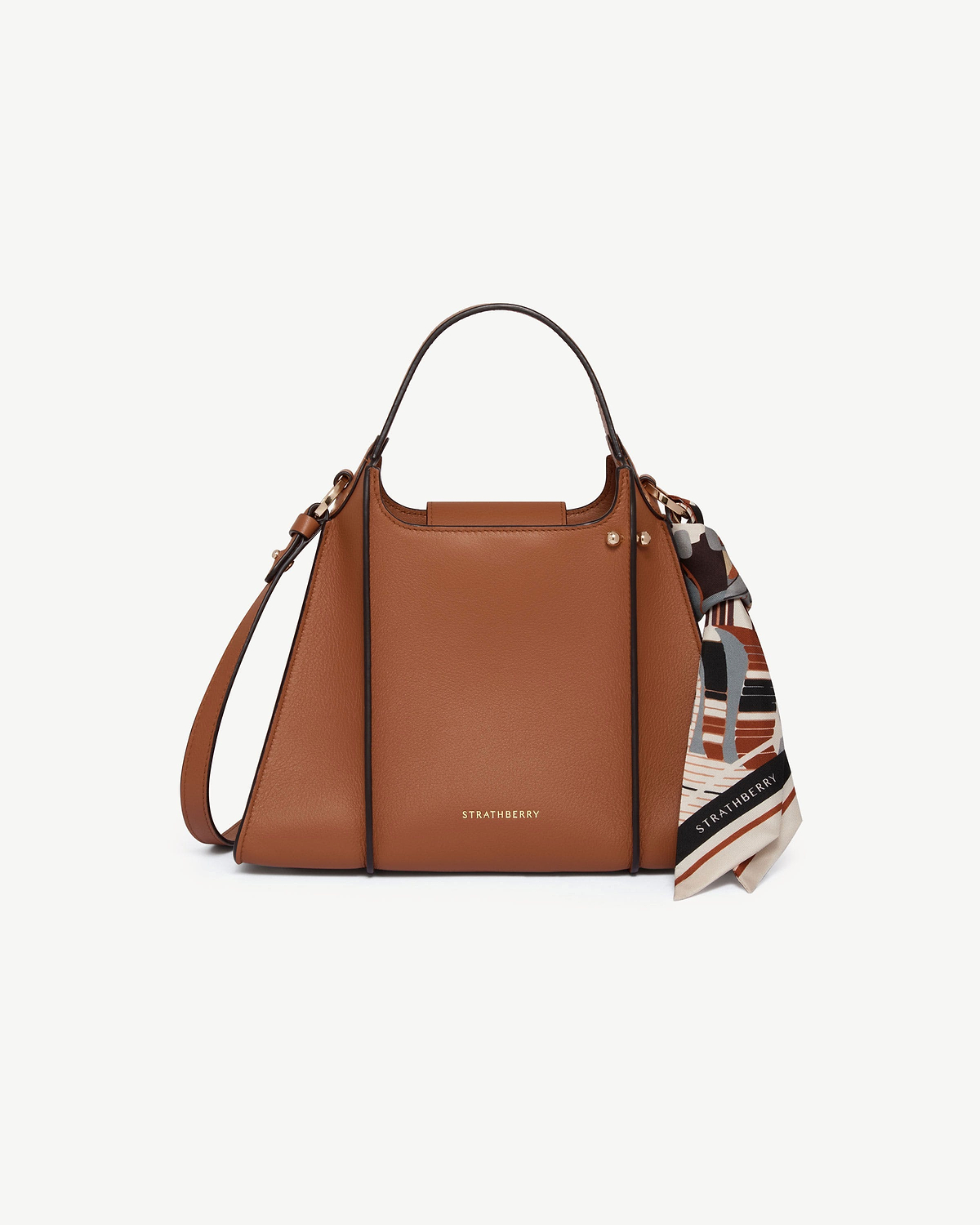 Strathberry Arkshell tan leather handbag with top handle, shoulder strap and printed scarf.