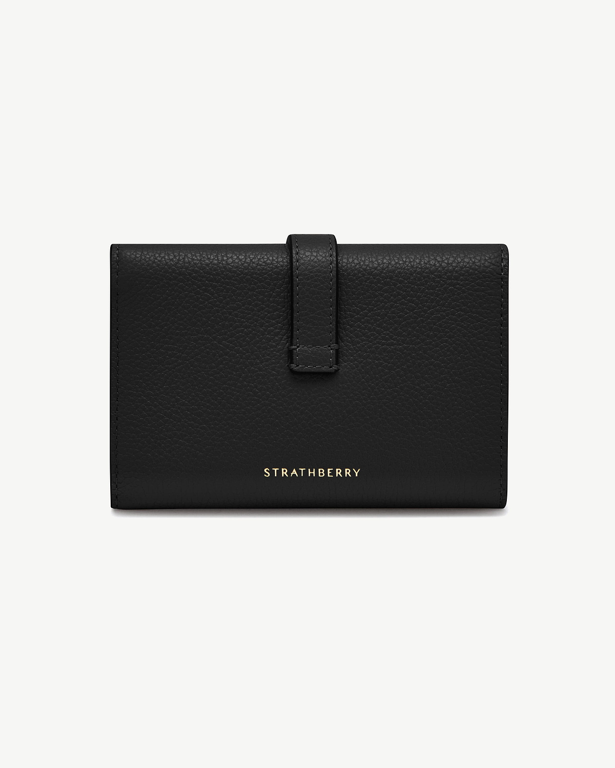 Black Kite medium trifold wallet with strap fastening and gold Strathberry logo