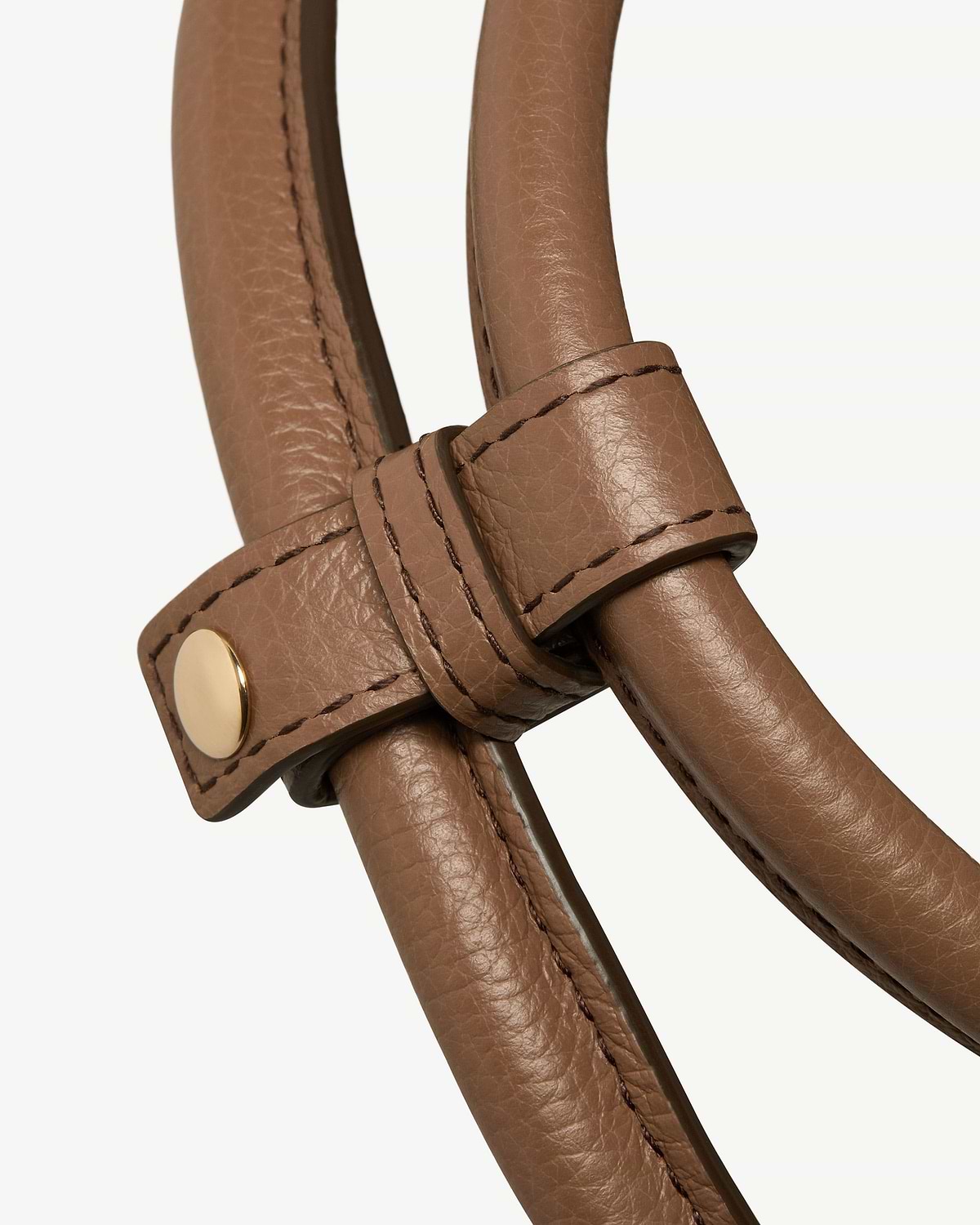Clay leather bag handles with stitched strap and gold stud detail.
