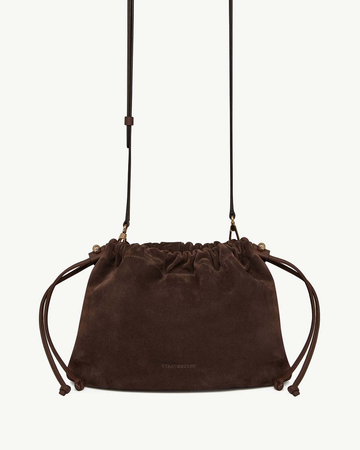 Chocolate suede drawstring bag with long leather shoulder strap and knotted side cords
