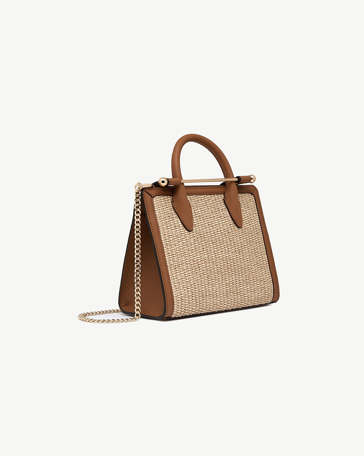 Tan leather-trim mini tote with natural raffia panels and gold chain strap.