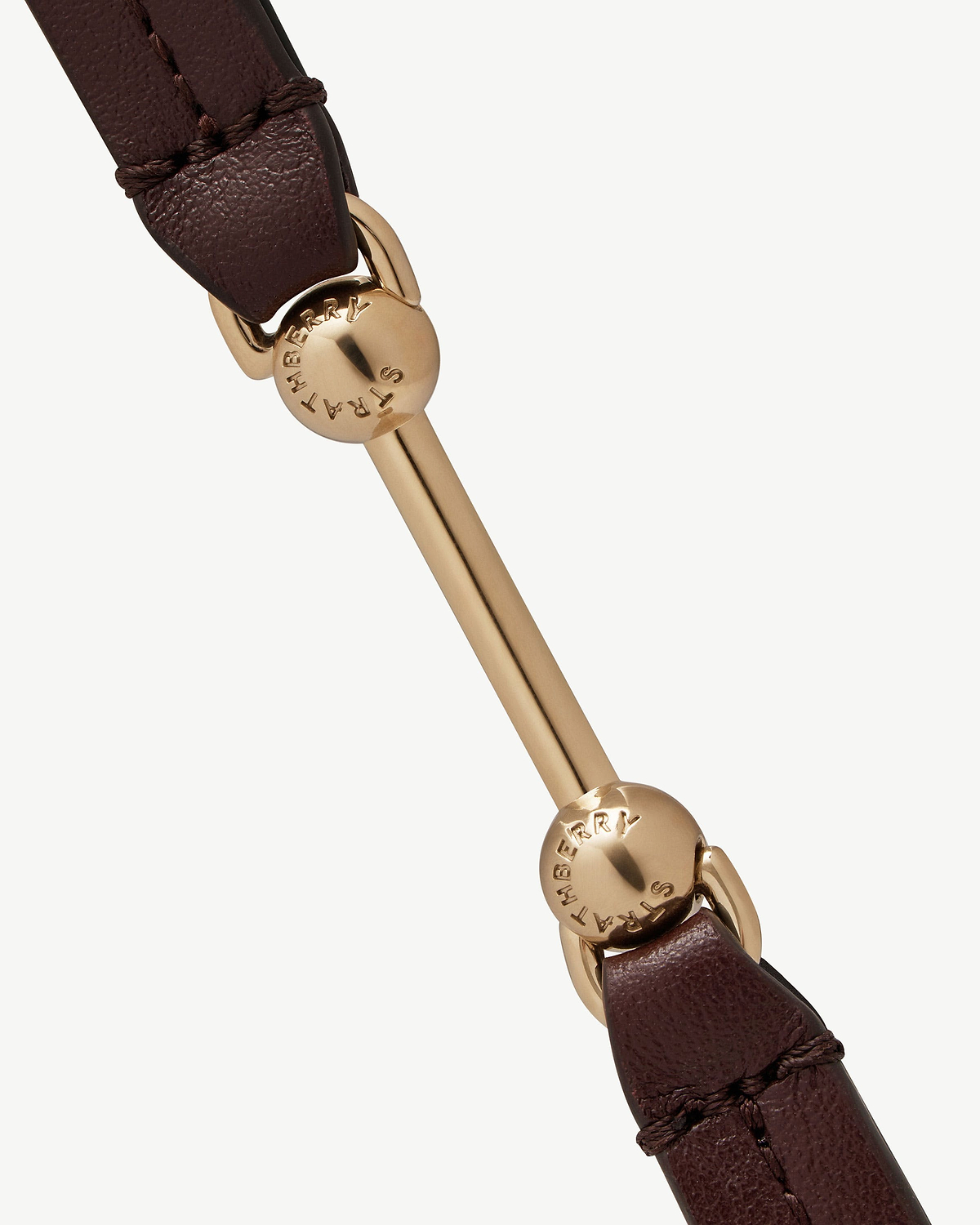 Burgundy leather double-wrap bracelet with gold ball hardware engraved Strathberry.