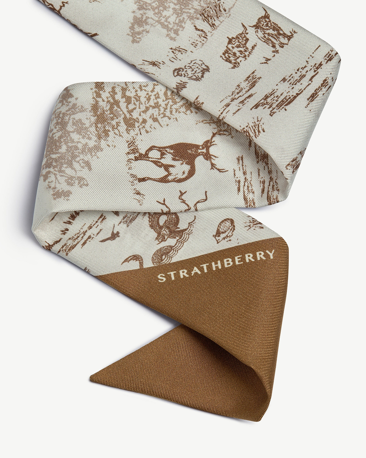 Tan and vanilla silk skinny scarf with animal wallpaper print and Strathberry logo.