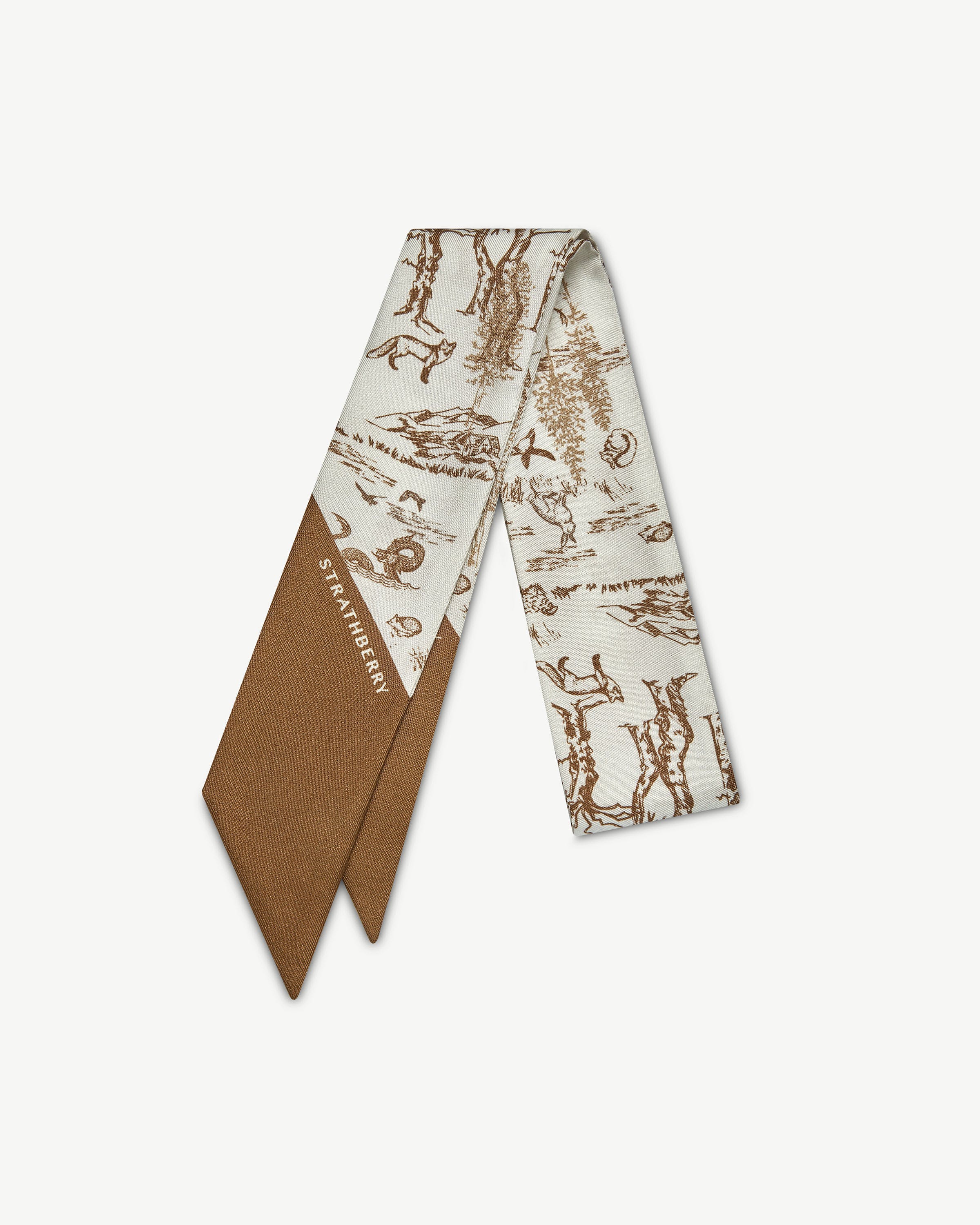 Tan and vanilla skinny scarf with animal wallpaper print and Strathberry logo.