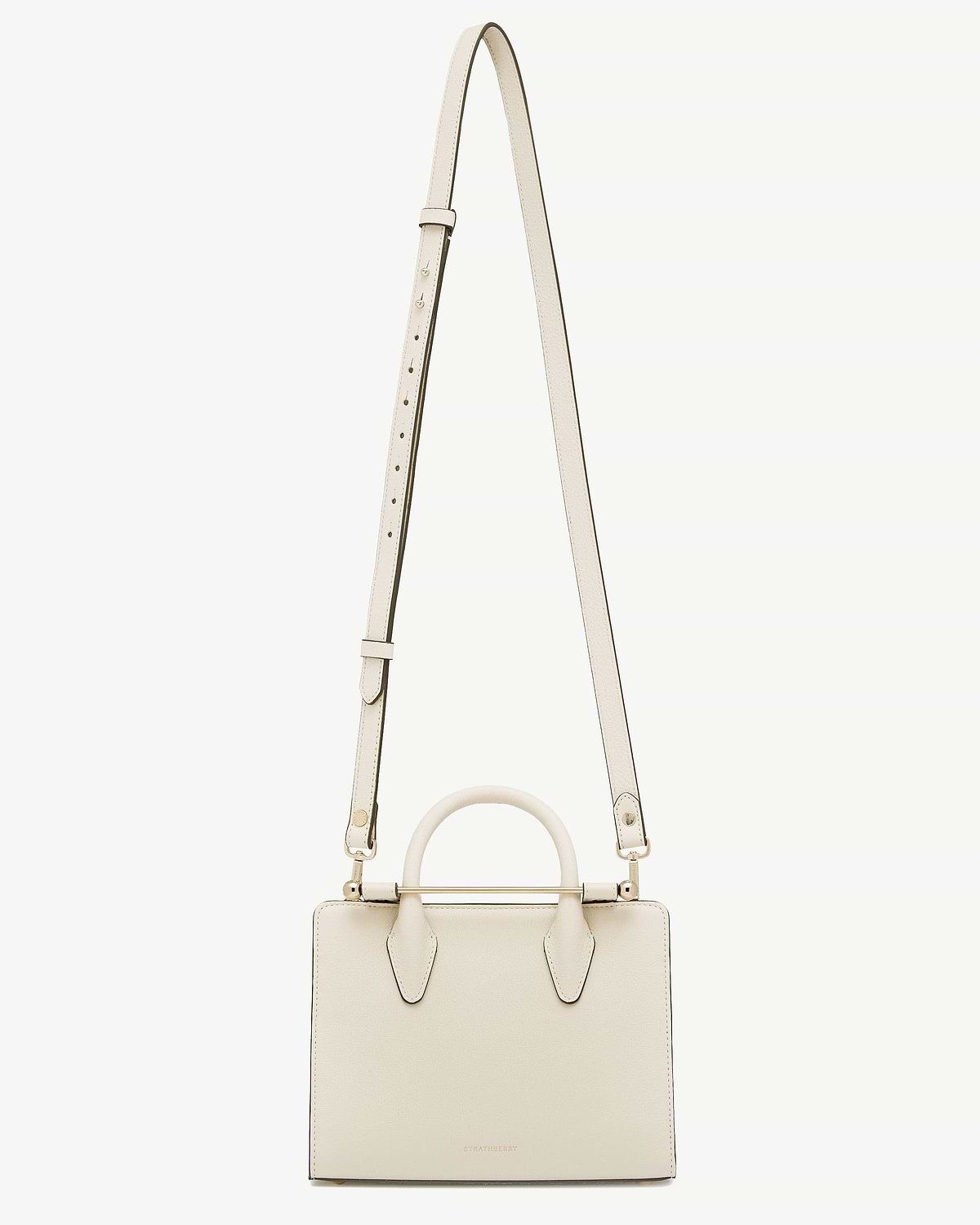 Vanilla leather handbag with top handle and thin adjustable shoulder strap, Strathberry logo.