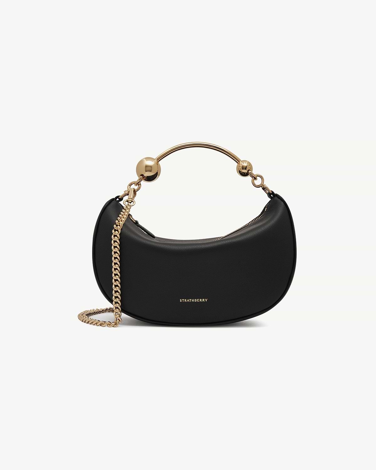 Black Crescent Moon Mini bag with gold chain strap and visible Strathberry logo.