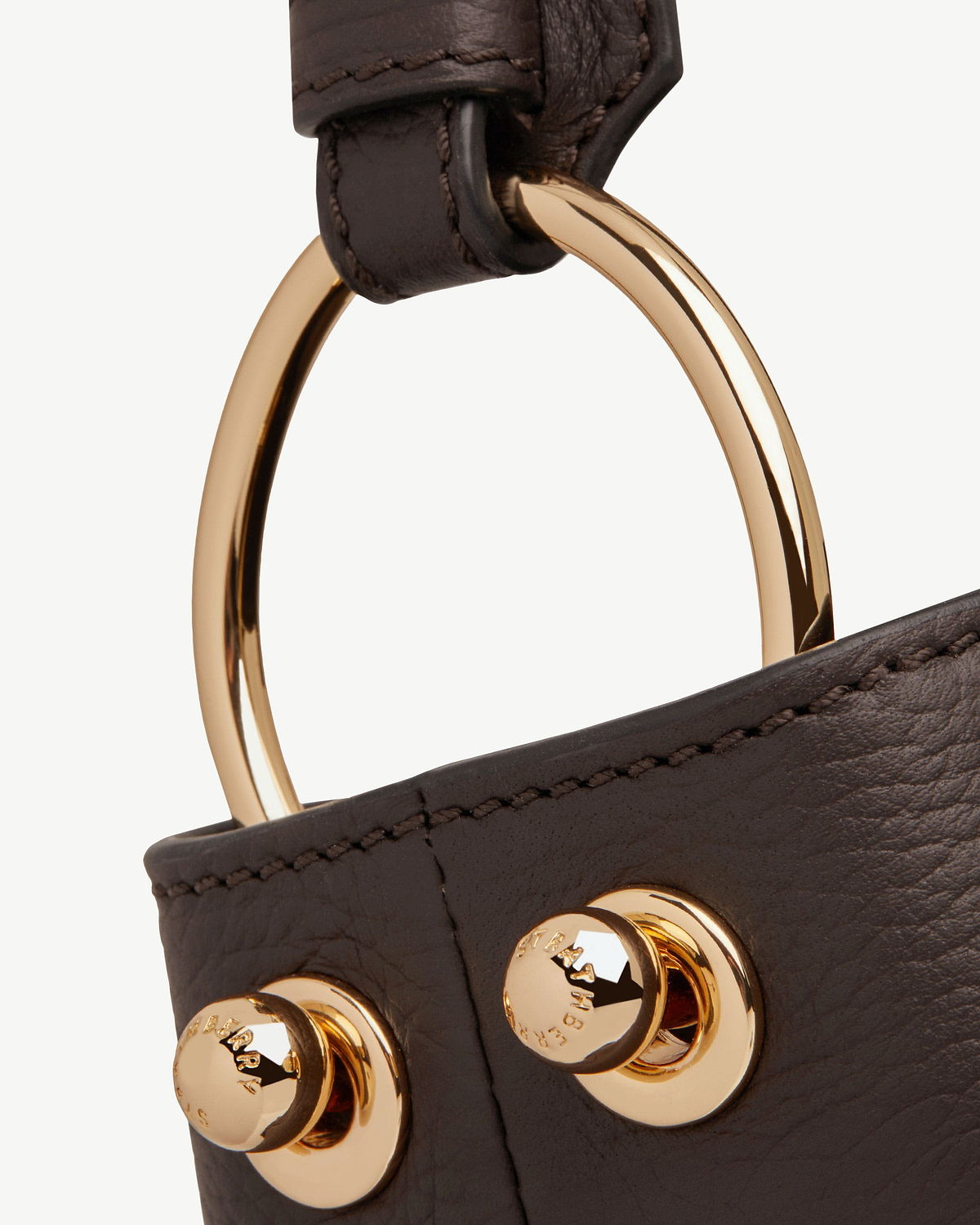Strathberry Lana Hobo espresso leather strap showing gold ring hardware and stitched seam
