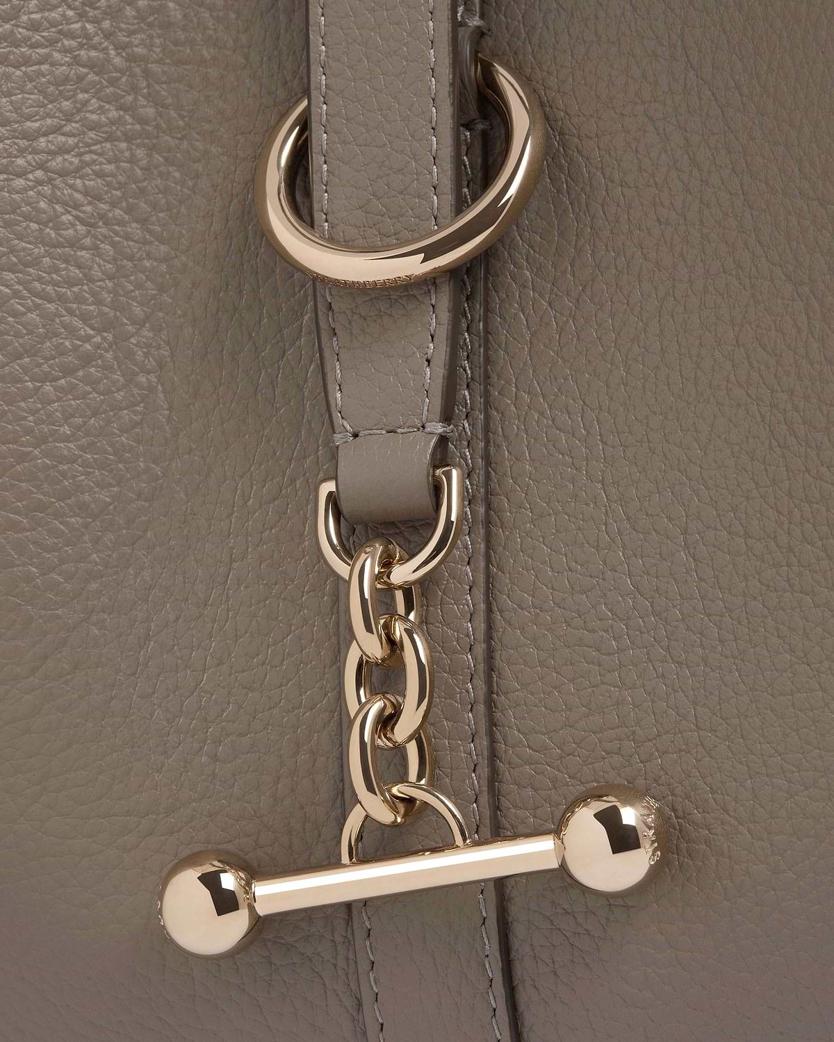 Taupe pebbled leather with gold chain and Strathberry engraved toggle