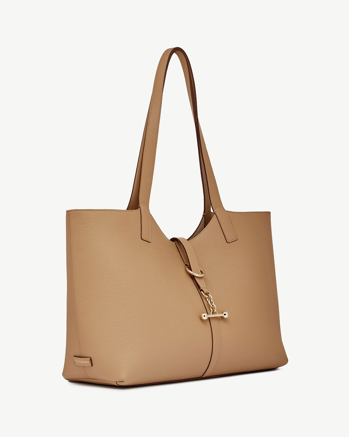 Caramel leather tote bag with long shoulder straps and gold bar fastening.