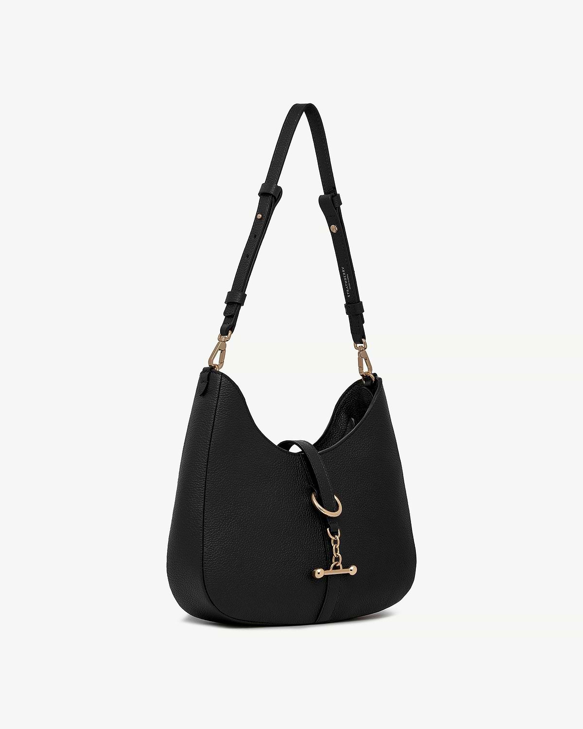 Black leather kite sling bag with gold hardware and adjustable shoulder strap.