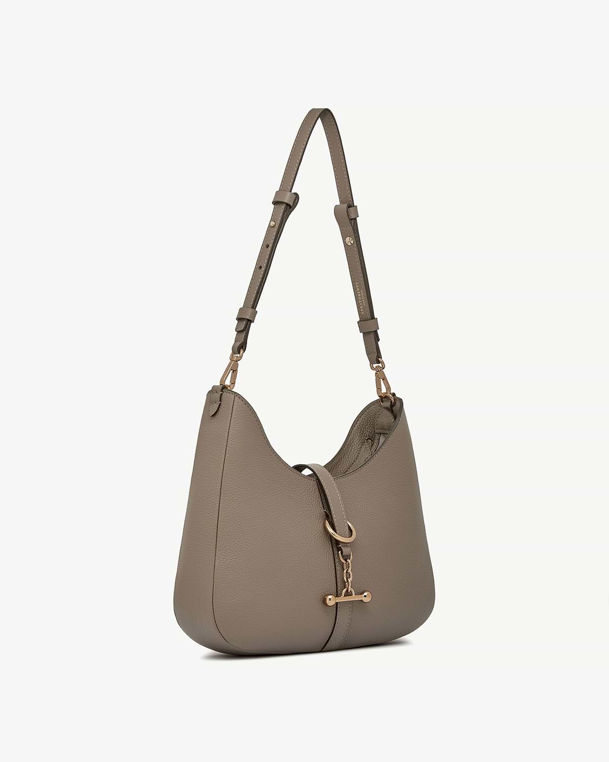 Taupe leather kite sling bag with gold hardware and adjustable shoulder strap