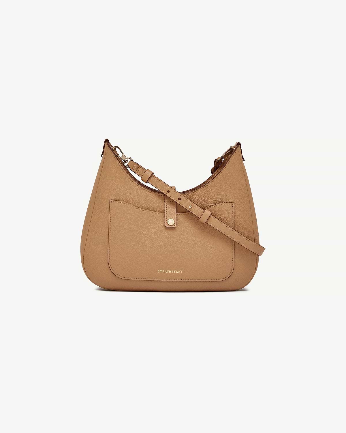 Caramel Strathberry kite sling bag with front pocket and adjustable shoulder strap.