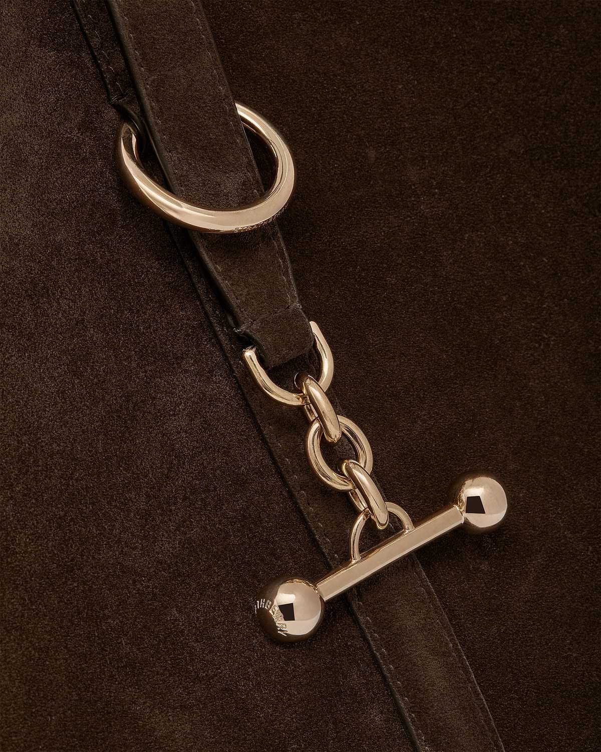 Chocolate suede tote strap with gold chain and bar hardware.
