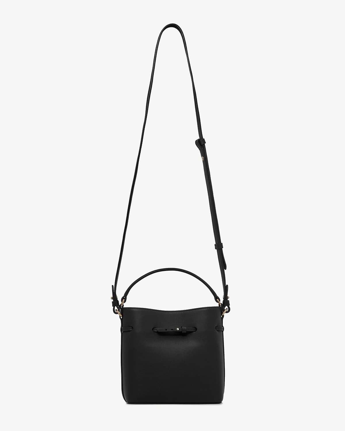 Black bucket mini bag with top handle, adjustable shoulder strap, front buckle detail.