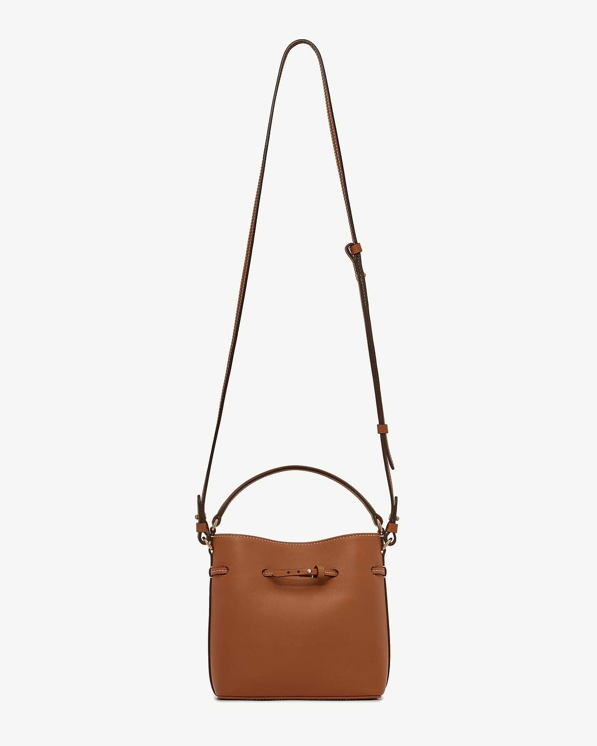 Chestnut leather bucket bag with top handle and long adjustable strap.