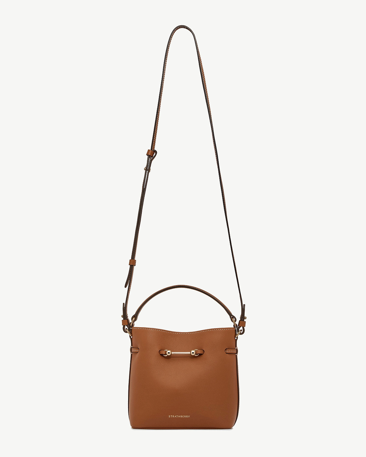Chestnut Corda Bucket Mini bag with adjustable strap, top handle, gold bar and Strathberry logo.