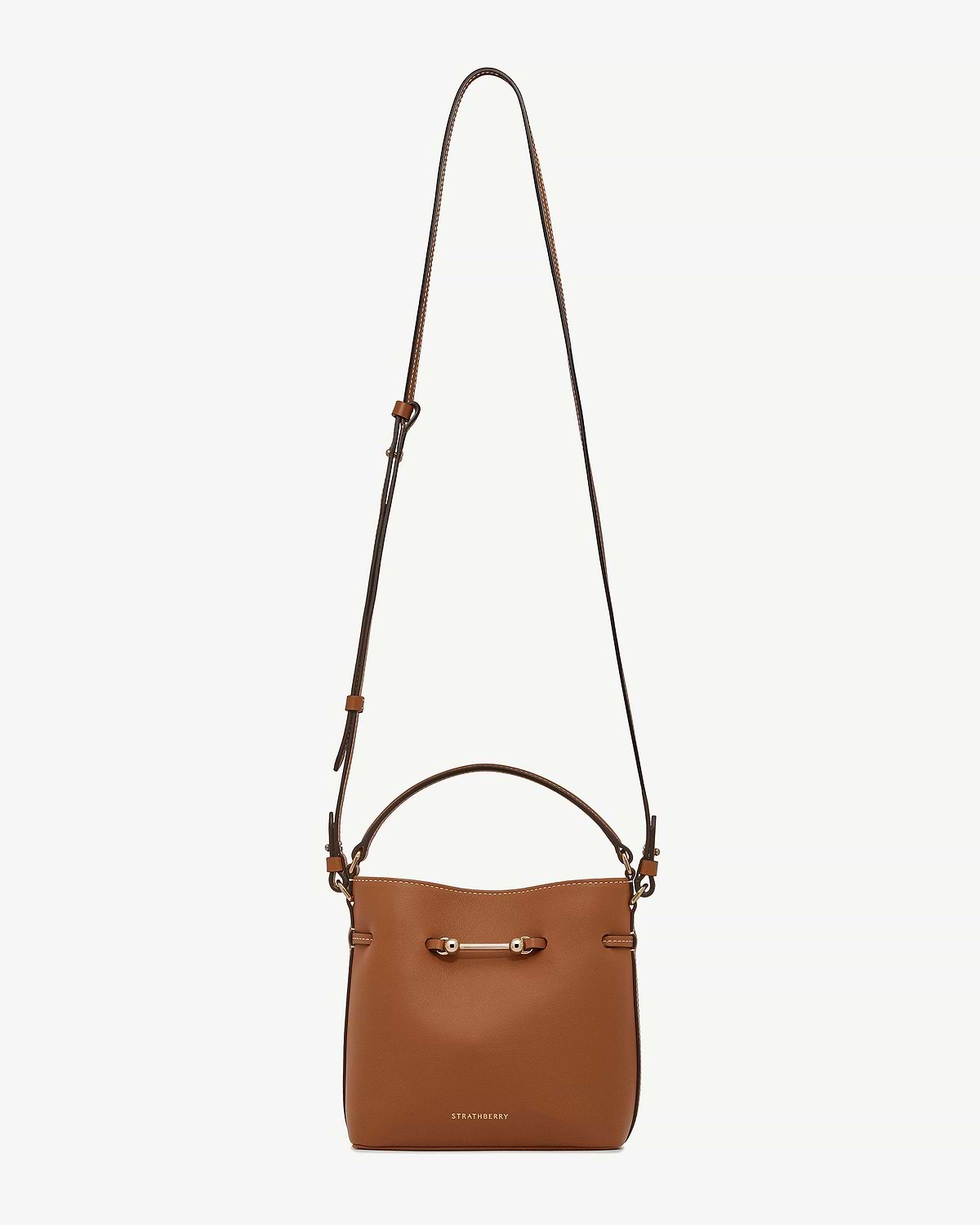 Chestnut Corda Bucket Mini bag with adjustable strap, top handle, gold bar and Strathberry logo.