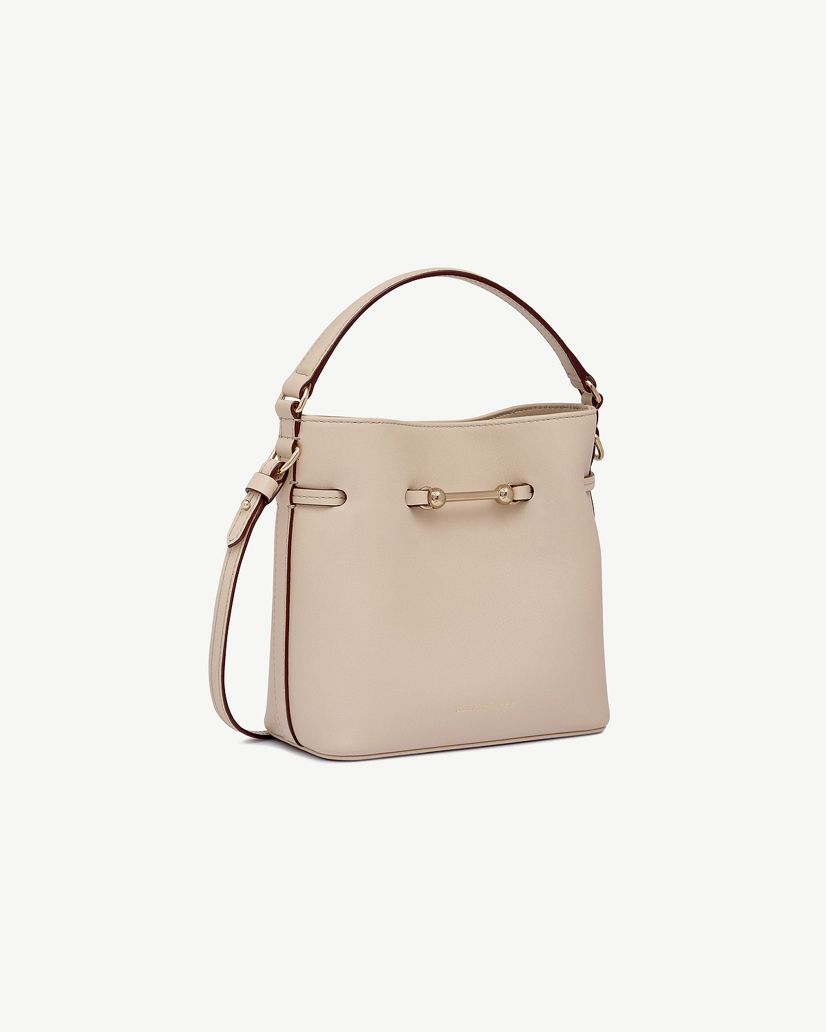 Oat mini bucket bag with top handle and adjustable shoulder strap.