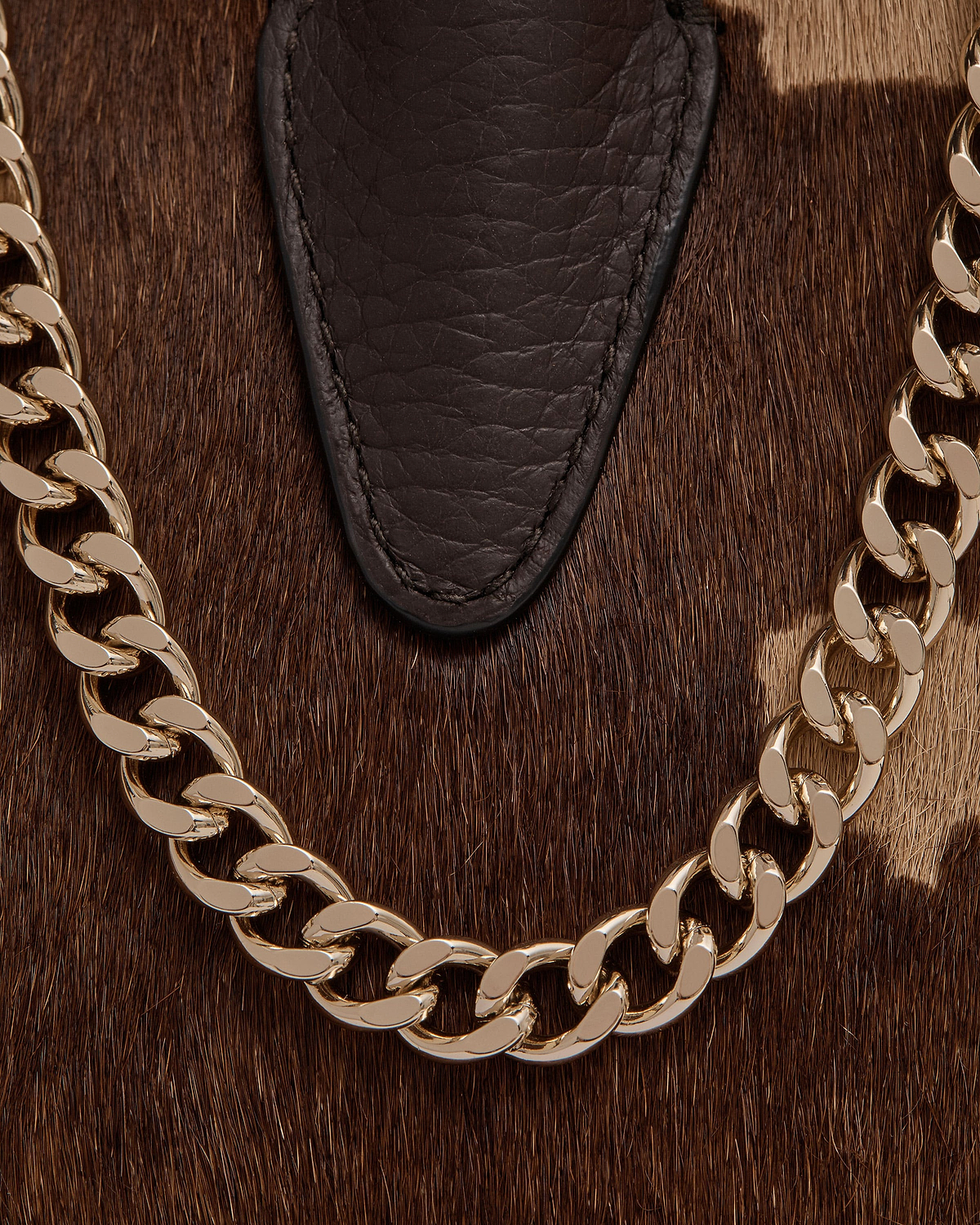 Sand and espresso spotted haircalf with dark leather trim and gold chain
