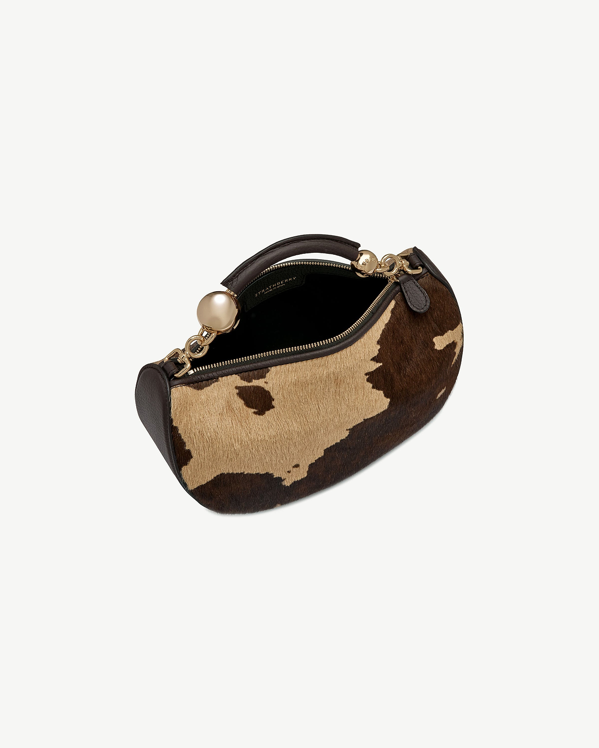 Strathberry Crescent Moon Mini bag in sand and espresso spot print.