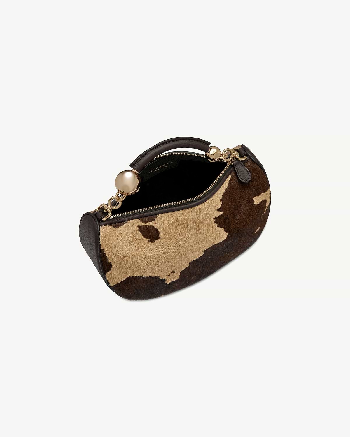 Strathberry Crescent Moon Mini bag in sand and espresso spot print.