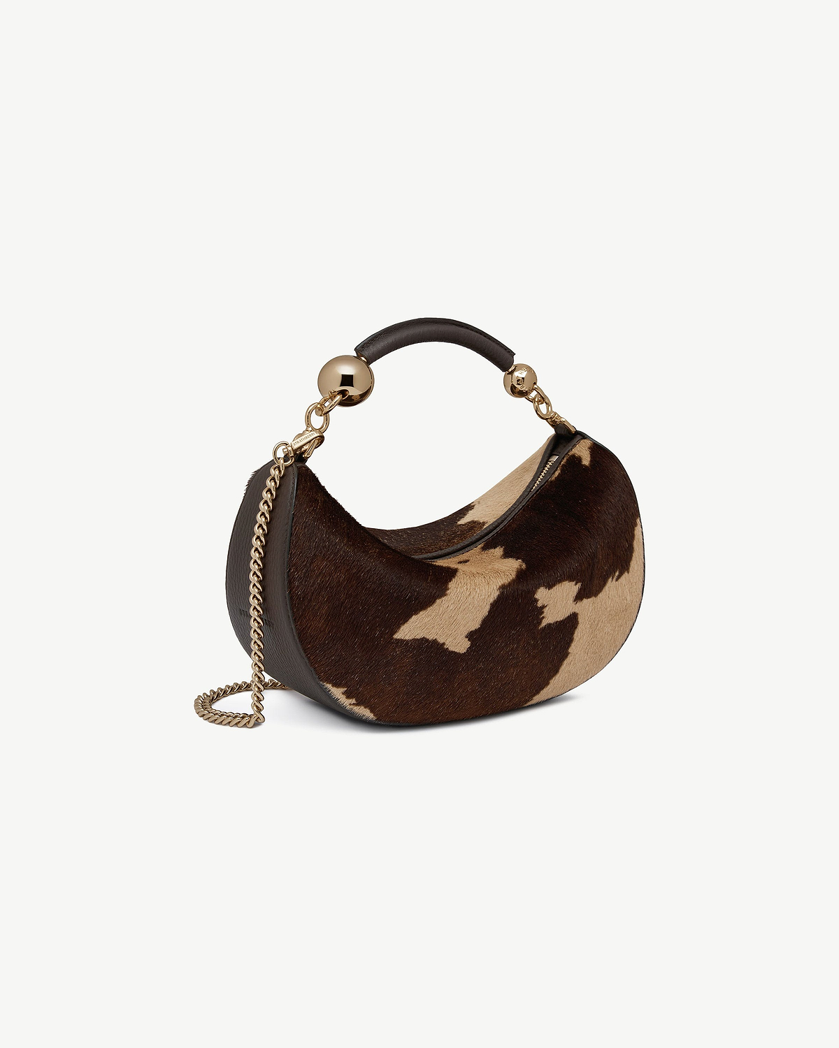 Crescent-shaped mini bag in sand and espresso spot print with gold chain and leather handle
