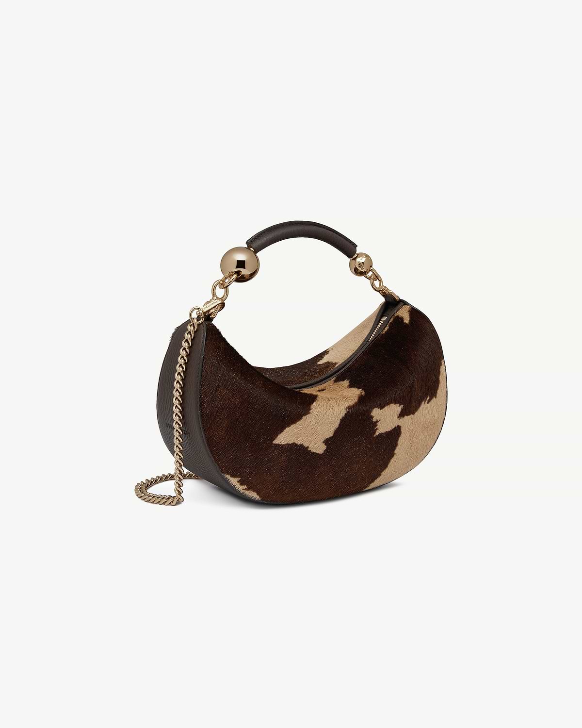 Crescent-shaped mini bag in sand and espresso spot print with gold chain and leather handle