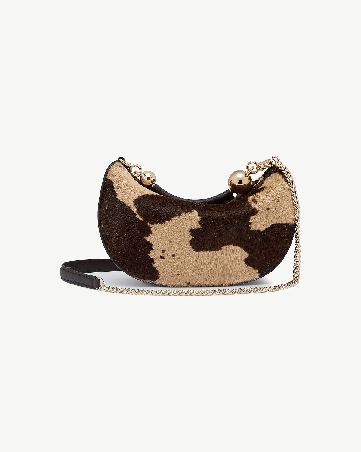 Crescent mini bag in sand and espresso spot haircalf with gold chain.