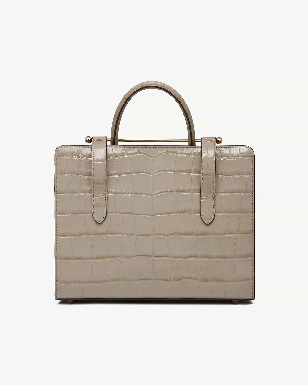 Beige croc-effect midi tote with top handles and gold bar detail.