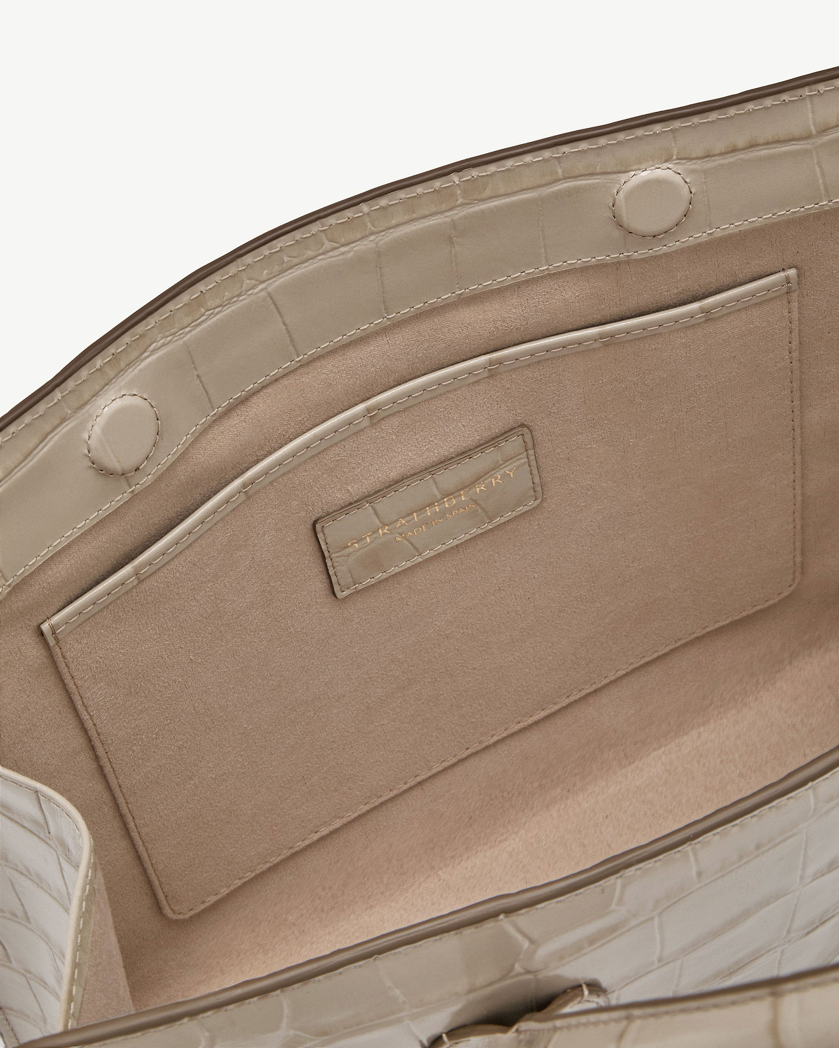 Beige croc midi tote interior with suede lining, pocket, magnetic snap, Strathberry label.