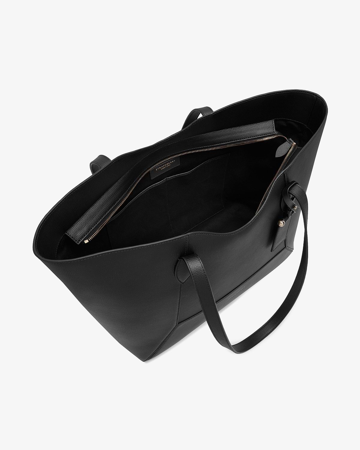 Black Mosaic Cabas tote open showing interior zip pocket and Strathberry label.