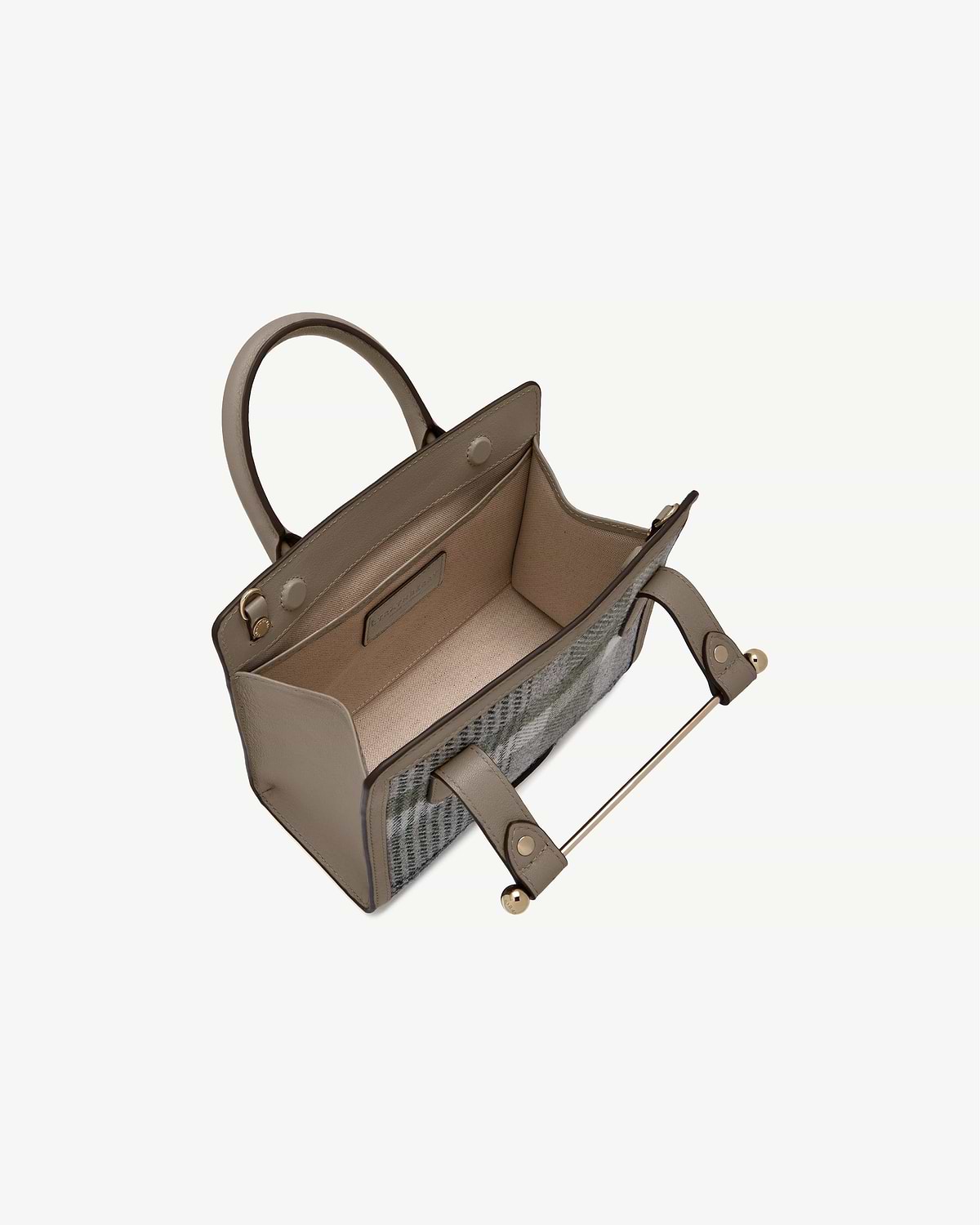 Mini tote with taupe leather trim and tartan exterior, open top showing interior.