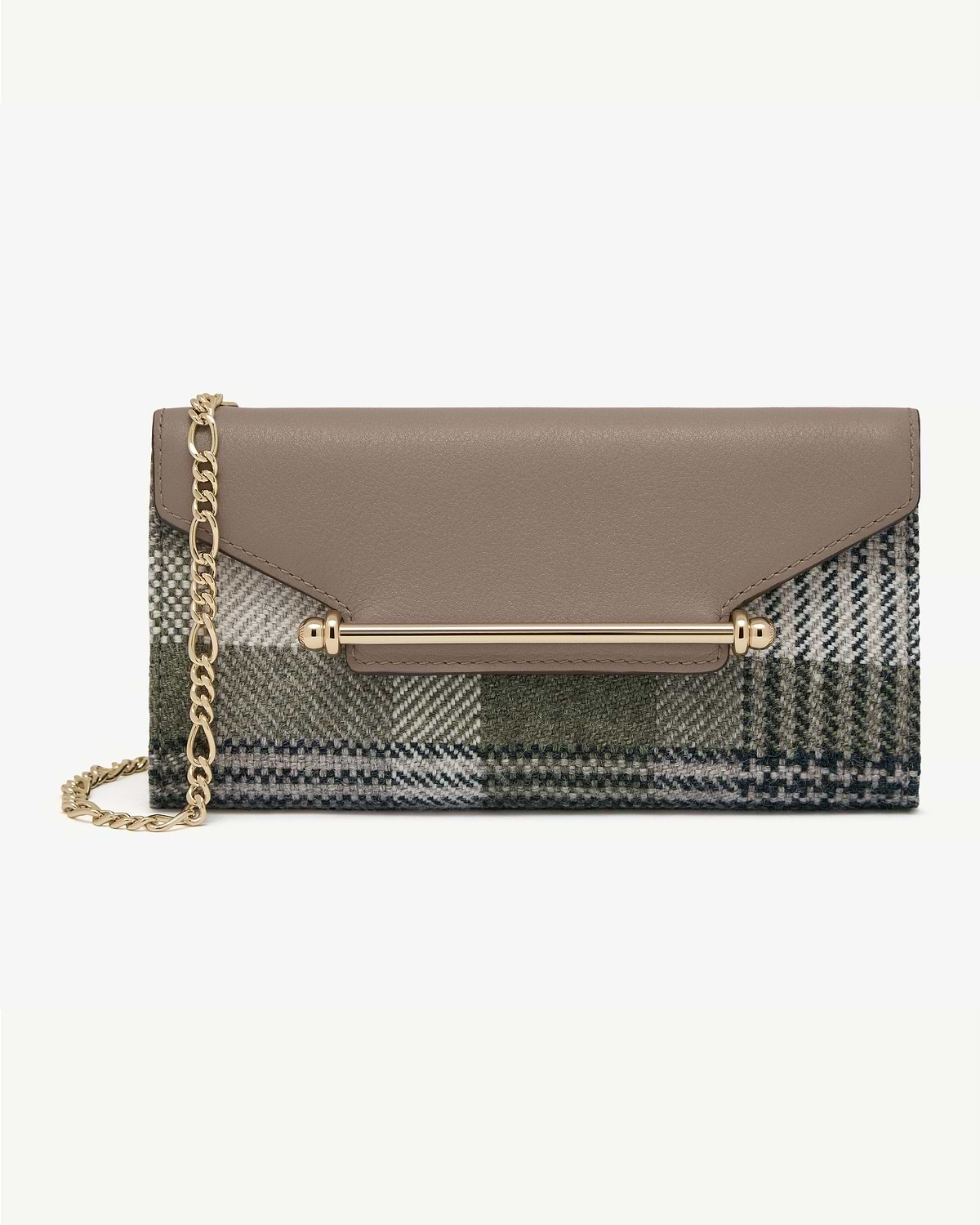 Taupe leather flap with gold bar and chain on tartan check wallet.