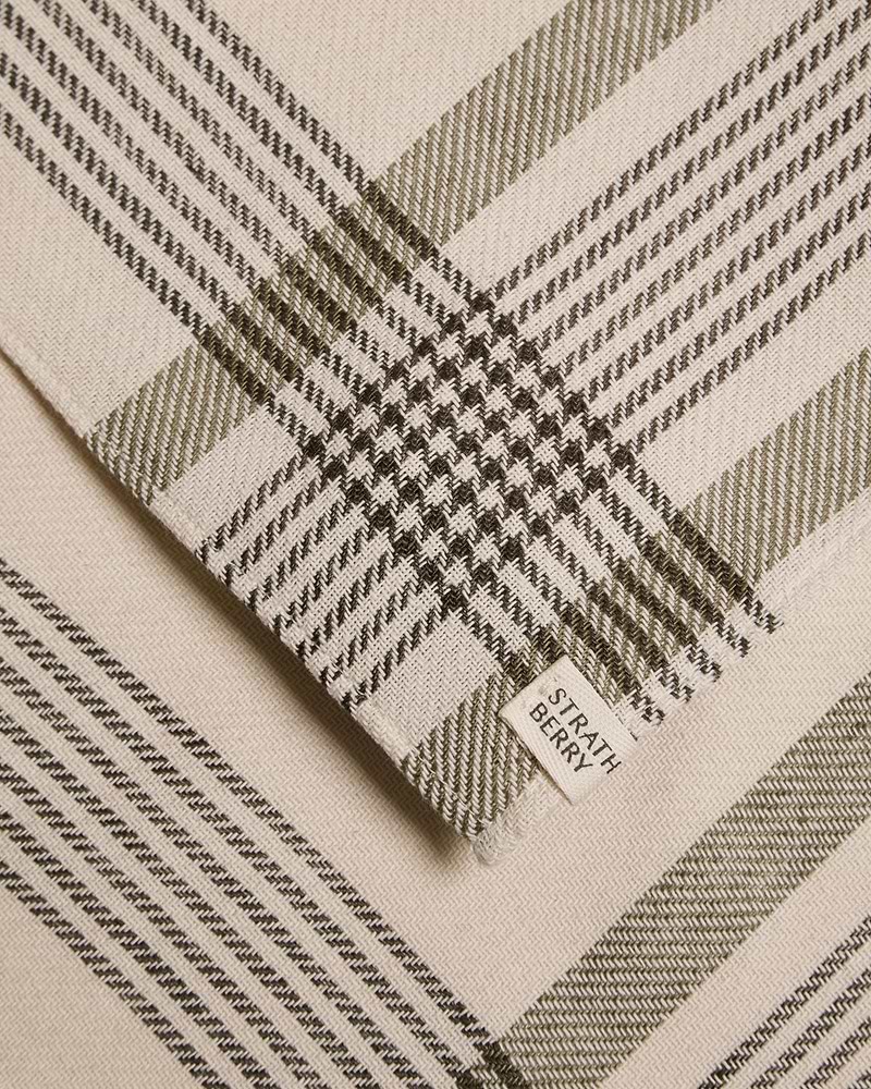 Beige and olive tartan cotton-linen table runner with Strathberry label.