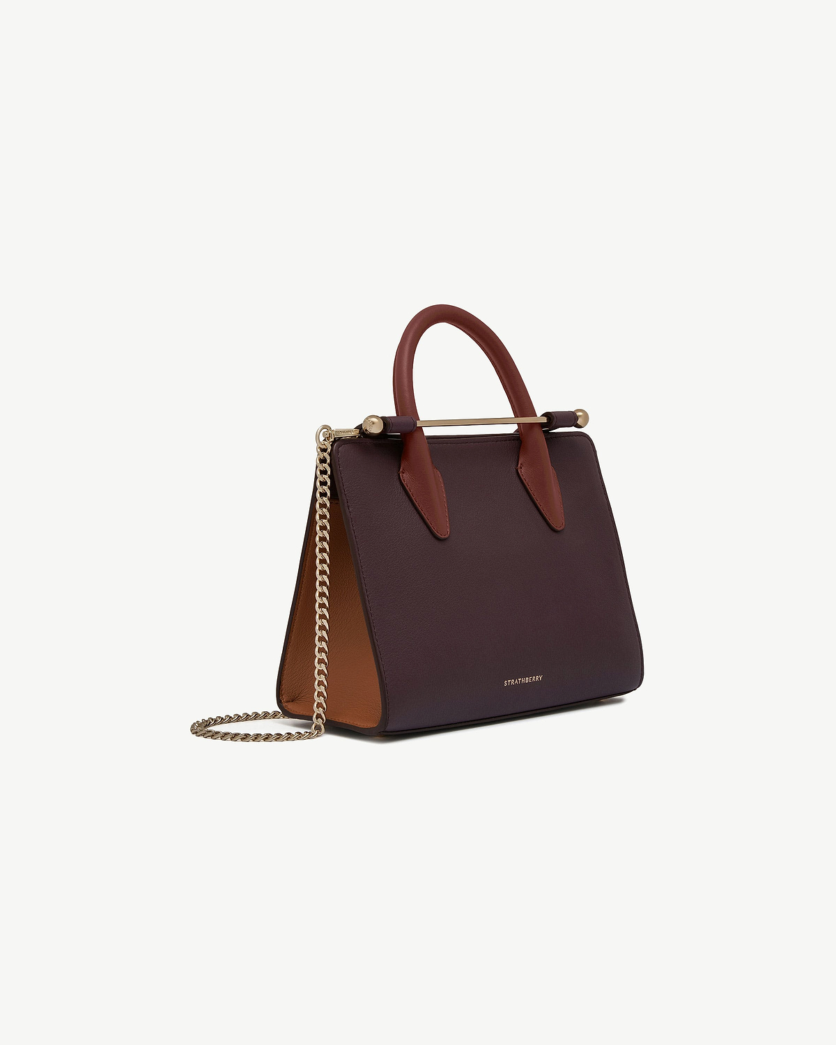 Strathberry mini tote in burgundy, chestnut and walnut with gold chain strap.