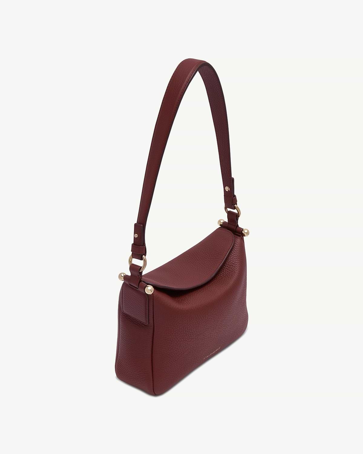 Oxblood pebbled leather shoulder bag with flap and gold hardware.