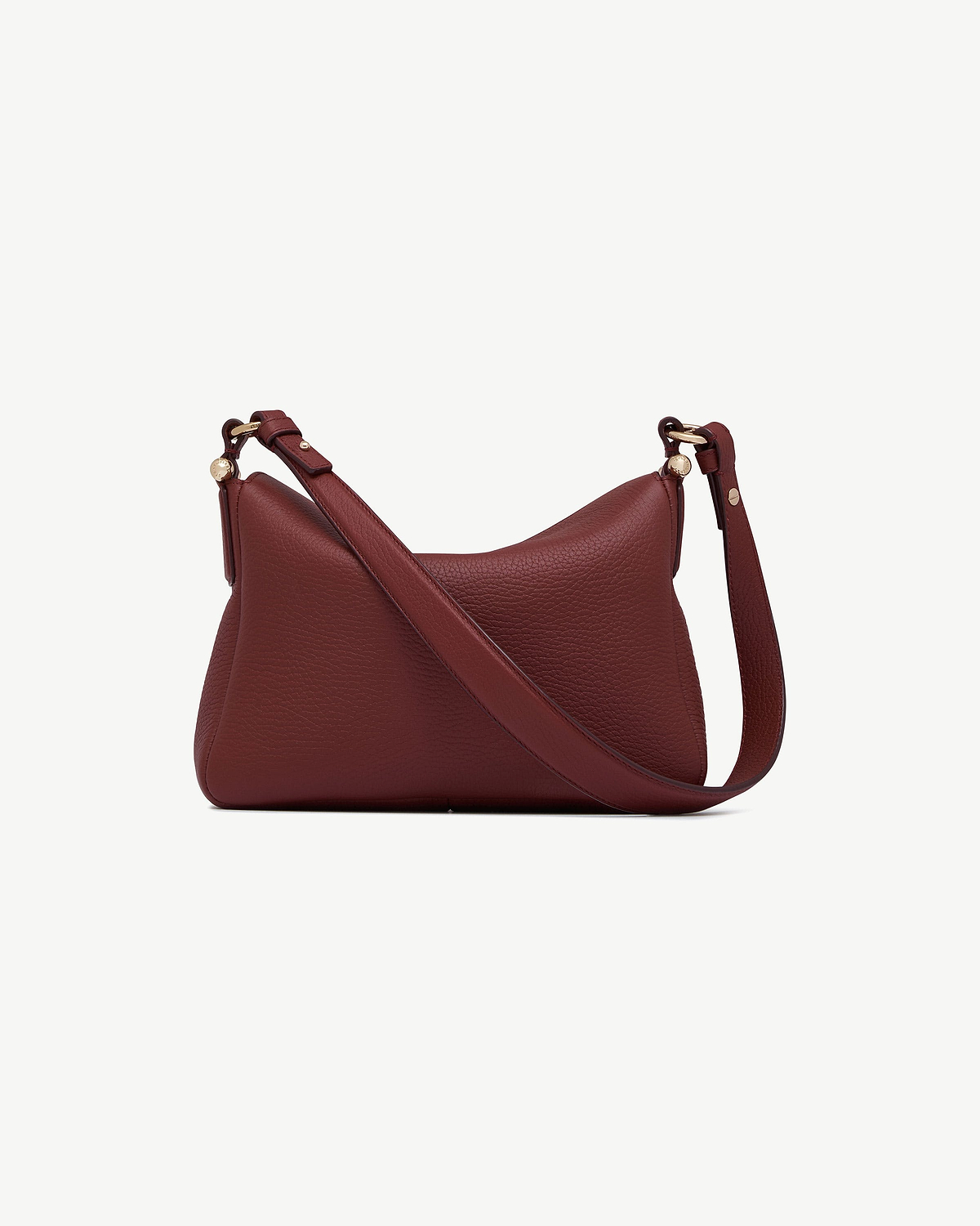 Oxblood Sway leather shoulder bag with adjustable crossbody strap and pebbled leather finish.